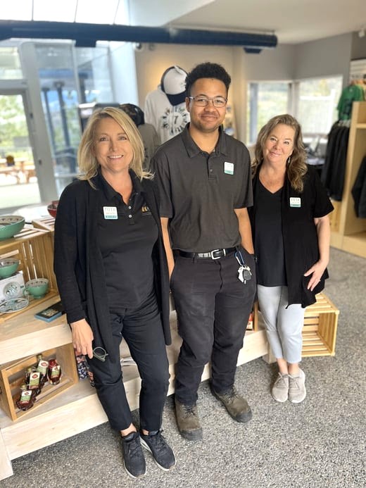 <who>Photo credit: Thompson Okanagan Tourism Association</who>Inspiration counsellors Barbara, Sam and Trina are ready to help at the Thompson Okanagan Tourism Inspiration Centre on the Okanagan Connector above Peachland.