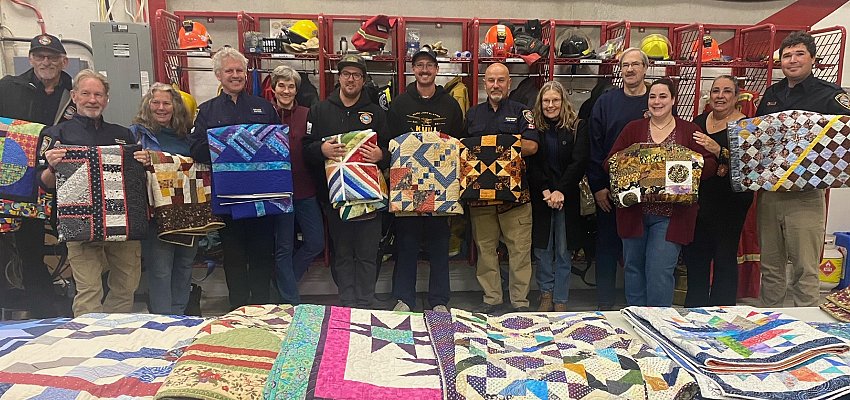 Local quilters donate work to Wilson’s Landing firefighters who lost their homes